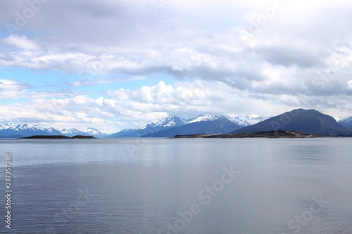  Calm waters of the Strait of Magellan. Blue sea water and mountains. Ushuaia, Patagonia, Argentina