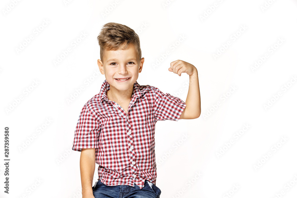 handsome boy shows his strength on white background handsome boy shows his strength on white background