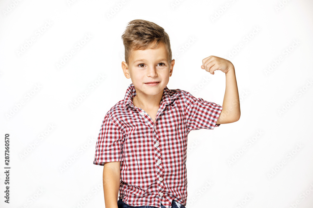 handsome boy shows his strength on white background handsome boy shows his strength on white background