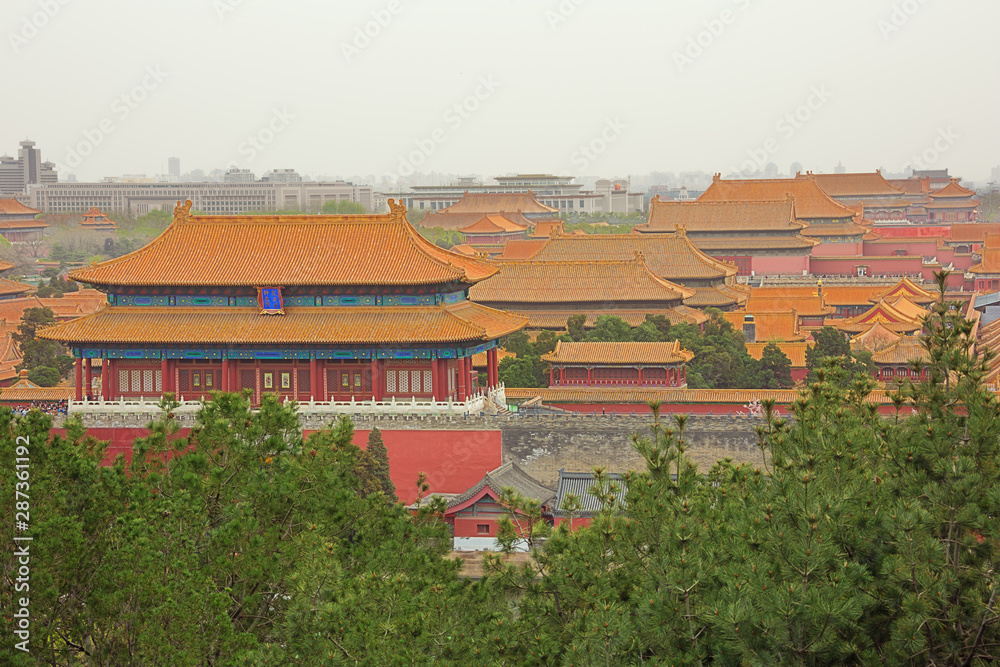 Looking over the roofs of the palaces in the Forbidden City, seen from the Jingshan Park in Beijing Looking over the roofs of the palaces in the Forbidden City, seen from the Jingshan Park in Beijing