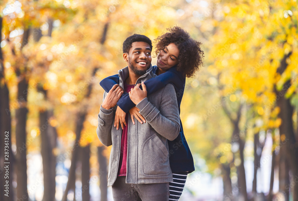 Fototapeta premium Happy lovely couple spending time at fall park
