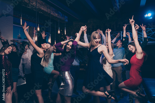 Nice gorgeous attractive smart glamorous slim fit cheerful positive stylish girls and guys having fun solemn festive festal lifestyle occasion celebratory in fashionable luxury place nightclub indoors