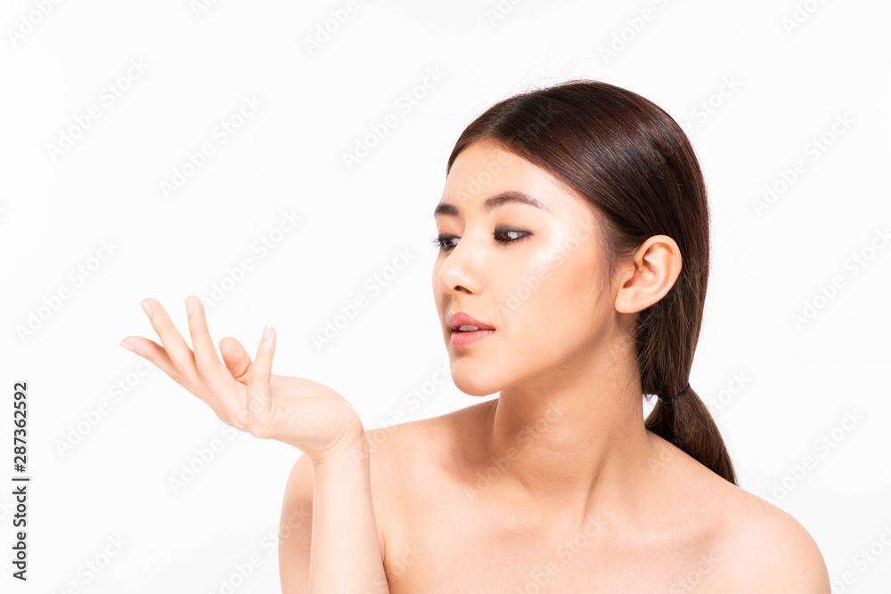 Asian woman showing empty copy space on the hand palm Asian woman showing empty copy space on the hand palm