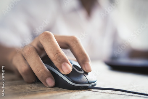 Close up of male hands are using computer mounts.
