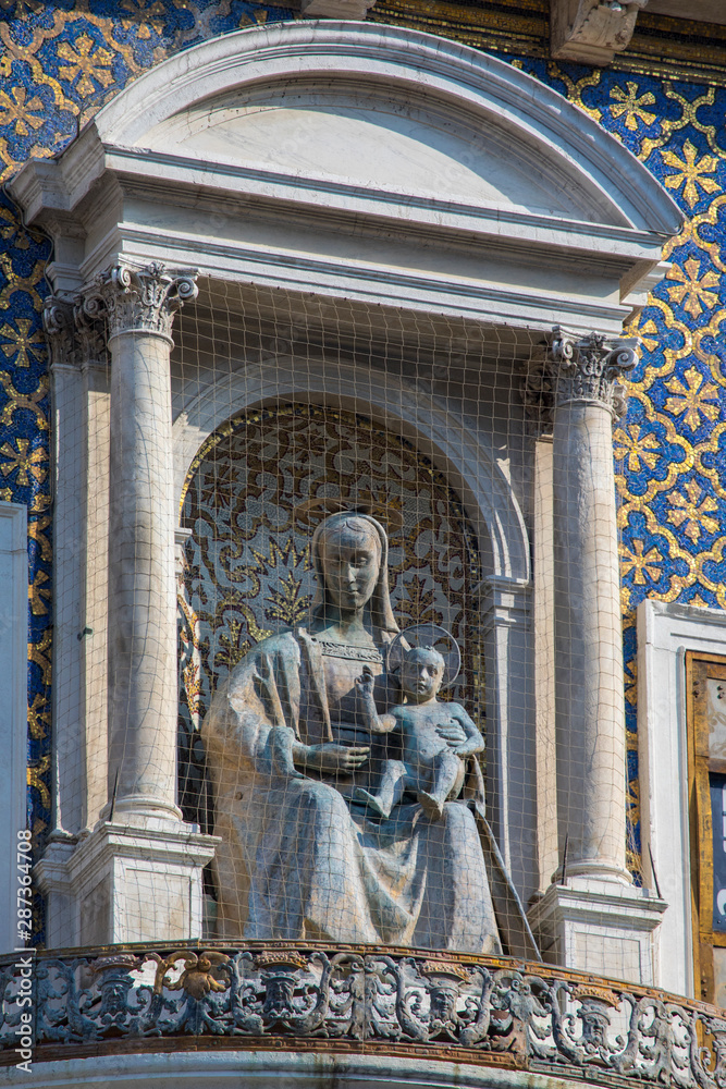 Sculpture of Virgin and Child on St. Marys Clock Tower in Venice