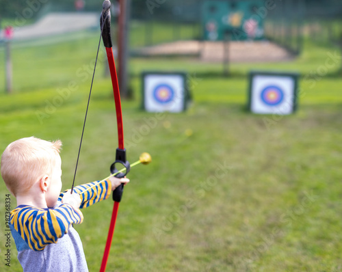 archer aiming with bow and arrow