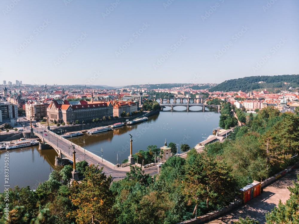 Scenic summer sunrise aerial view of the Old Town pier architecture and Charles Bridge over Vltava river in Prague, Czech Republic, travel tour to Europe concept design.