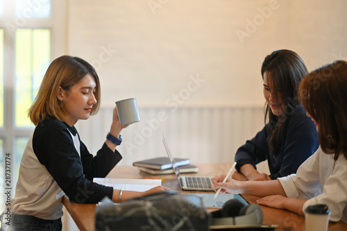 Three woman tutor exam education on table.