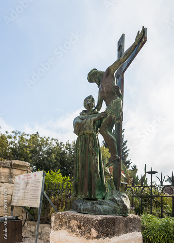 The bronze statue of Joseph removes Jesus Chrysia from the cross on the territory of the catholic Christian Transfiguration Church located on Mount Tavor near Nazareth in Israel