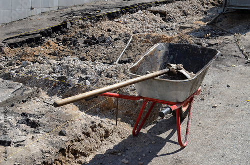 Wheelbarrow with a shovel at a construction site