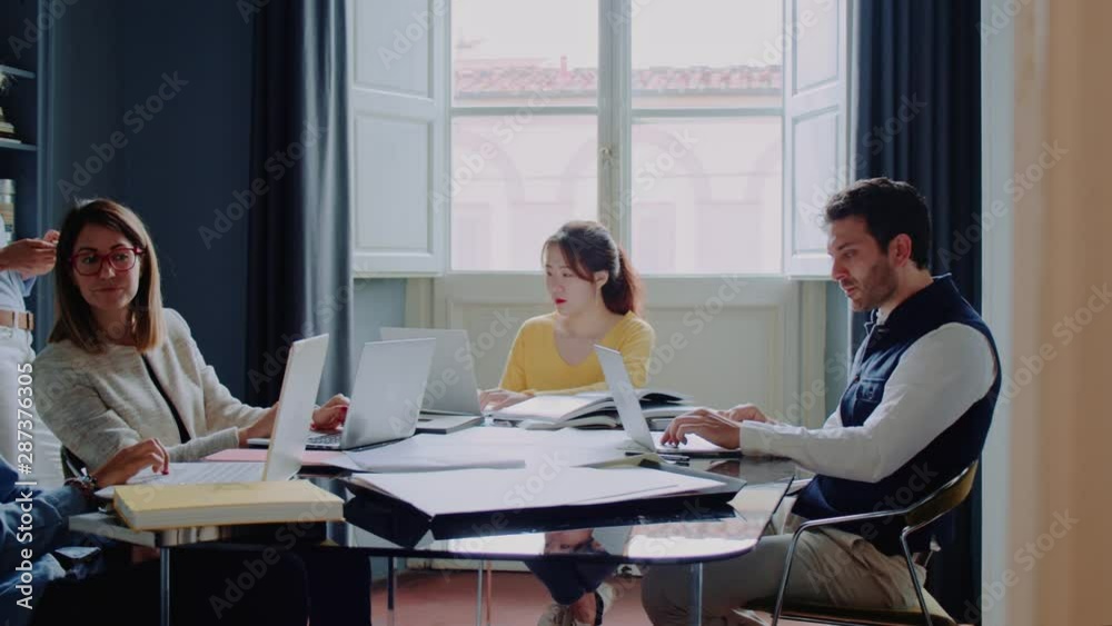 Group of creative people working together in the office Group of creative people working together in the office