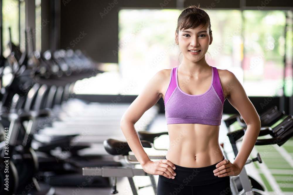 Asian women have pretty good health Six Pack're stretching poses gracefully in the gym. Asian women have pretty good health Six Pack're stretching poses gracefully in the gym.
