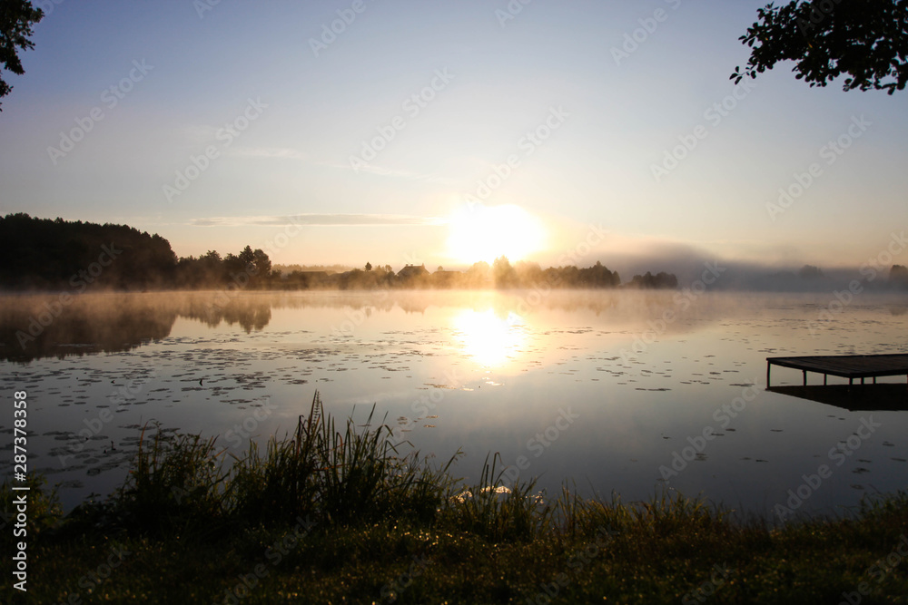 fog over river in early summer morning