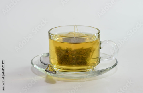 Tea and Green Tea bag in glass cup is ready to drink