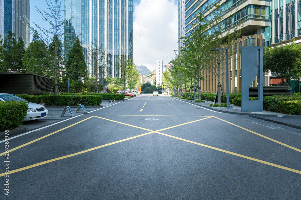 empty highway with cityscape and skyline of qingdao,China.