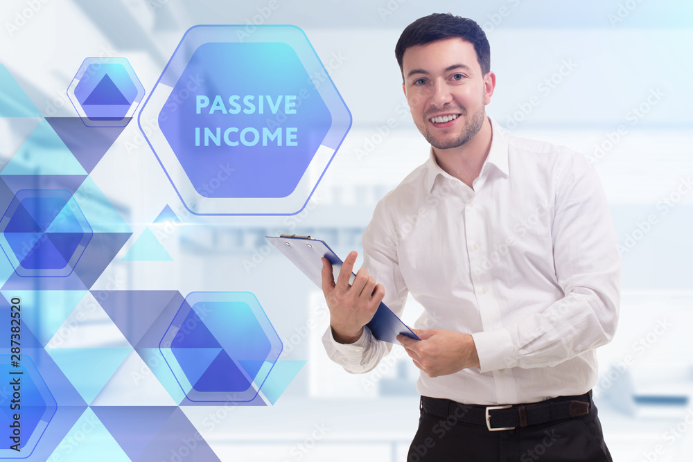 The concept of business, technology, the Internet and the network. A young entrepreneur working on a virtual screen of the future and sees the inscription: Passive income The concept of business, technology, the Internet and the network. A young entrepreneur working on a virtual screen of the future and sees the inscription: Passive income
