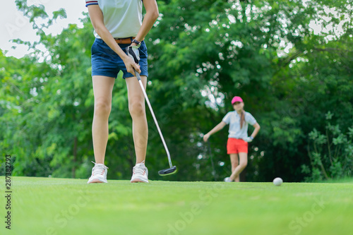 Young women player golf swing shot on course in morning sunrise © Aunging
