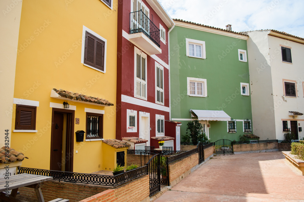 Port Saplaya. Valencia, Spain. May 16, 2019. View on the colorful houses of the port Saplaya in the city of Valencia, Spain.