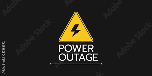 the banner of a power cut with a warning sign the one is on the solid black background. photo