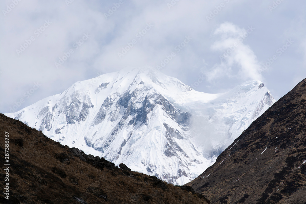 Mountain peak with snow, cloud and fog, Himalayas, Nepal