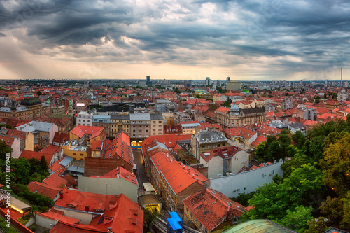 Panoramic view of Zagreb Old city from Lotrscak tower. Scenic cityscape of Lower town with historical buildings and small funicular, popular tourist attraction, Croatia. Outdoor travel background photo