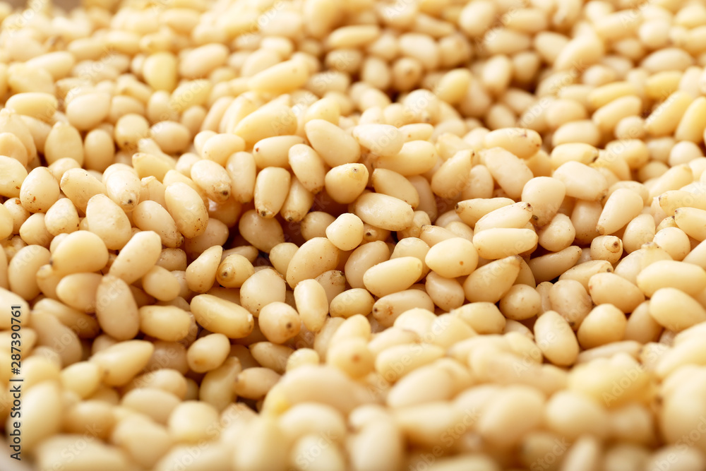 Background texture of shelled pine nuts. Cedar. Background texture of shelled pine nuts. Cedar.