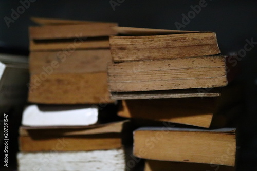 pile of old books on white background