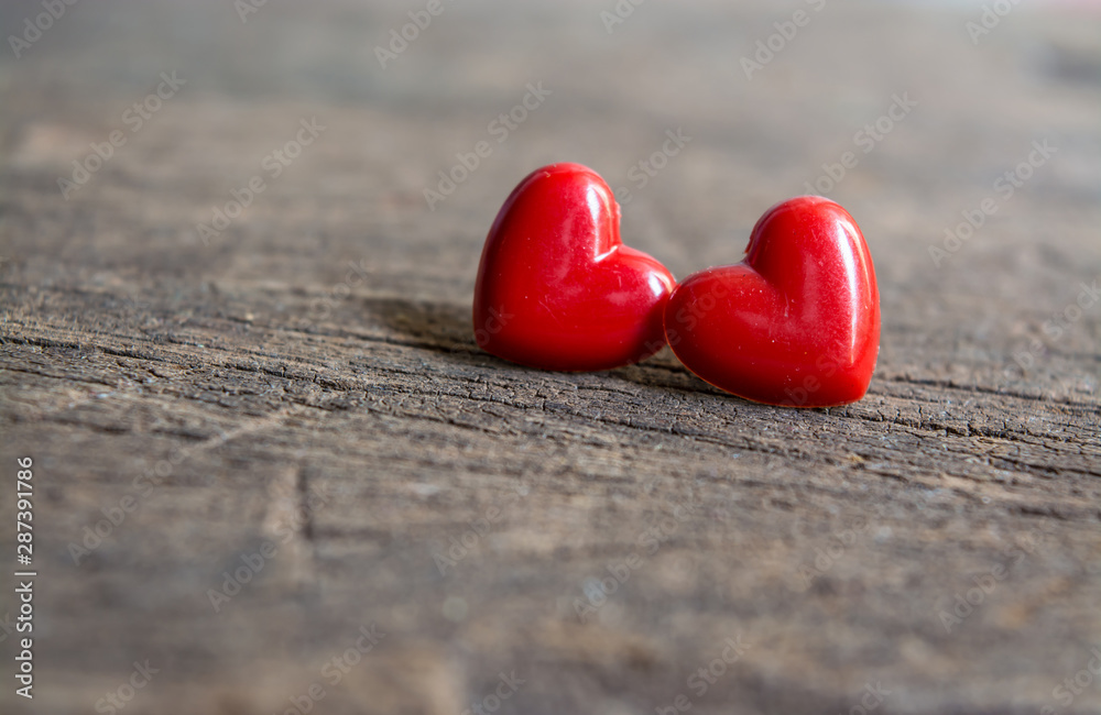 Fototapeta premium Two red heart on wooden background