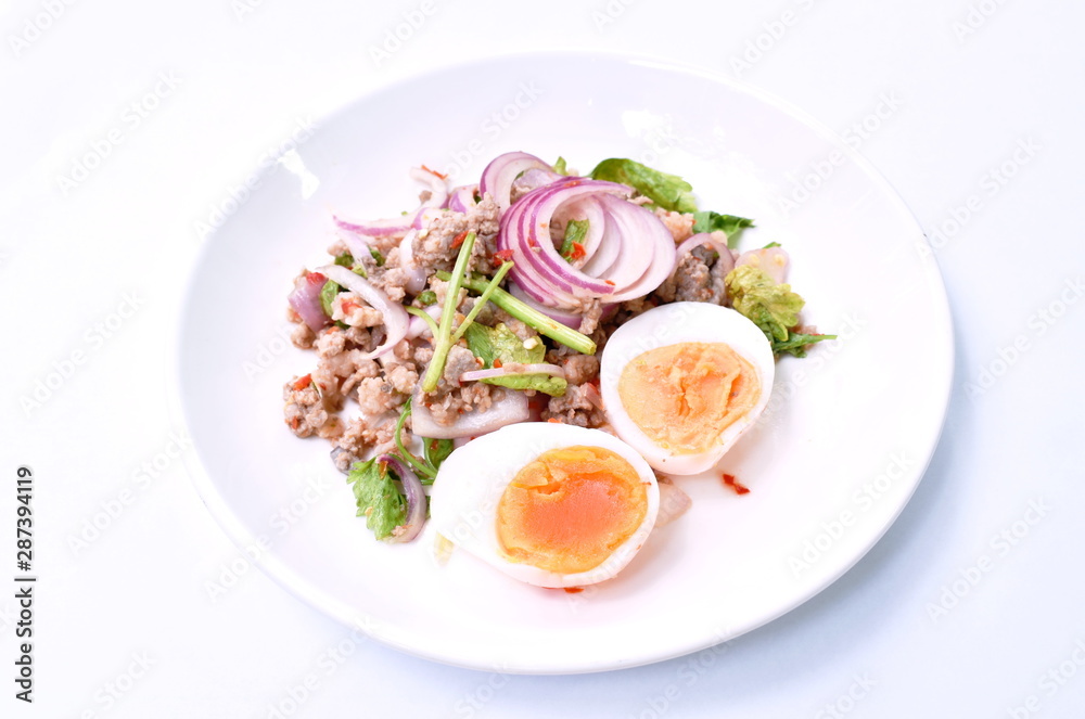 boiled egg half cutting topping sour and spicy minced pork salad on plate boiled egg half cutting topping sour and spicy minced pork salad on plate
