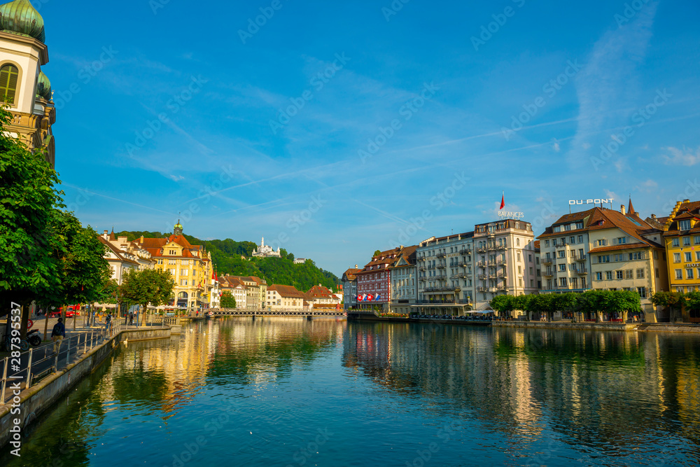 Reuss River and City of Lucerne in a Sunny Day in Switzerland.