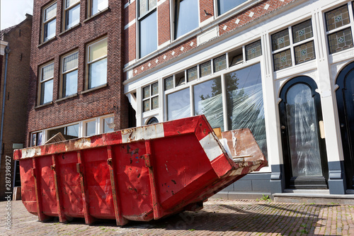 Red skip in a street in Rotterdam