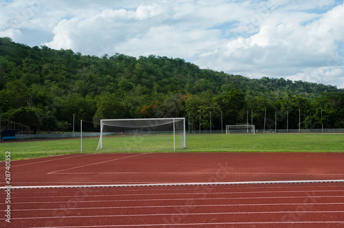 Football or soccer field and goal in sport stadium. © peerayot