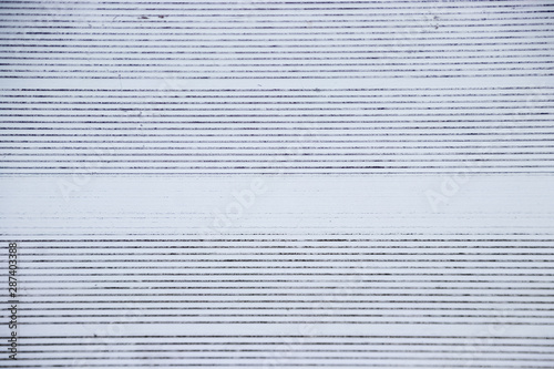View directly overhead of pattern on metal bleachers in stadium of local high school