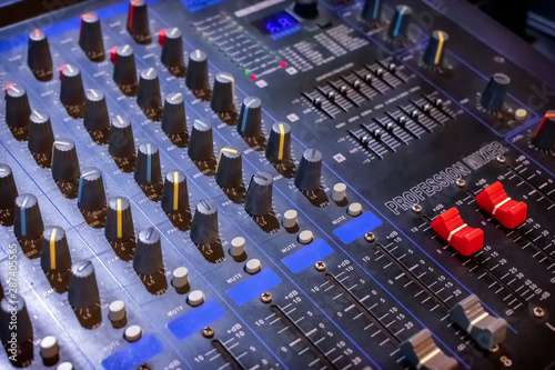 Professional Analog Audio Mixing Control Console in use.