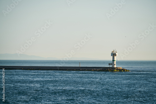 blue waves and lighthouse background