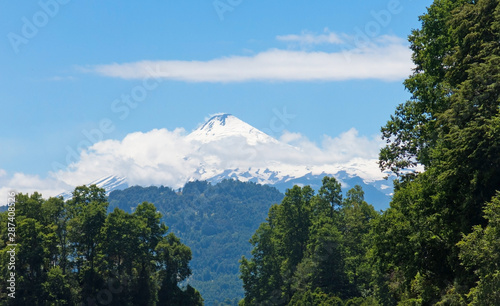 the snowy Villarrica Volcano from the Pullinque lagoon  in the Chilean Patagonia  Los Rios region. Chile