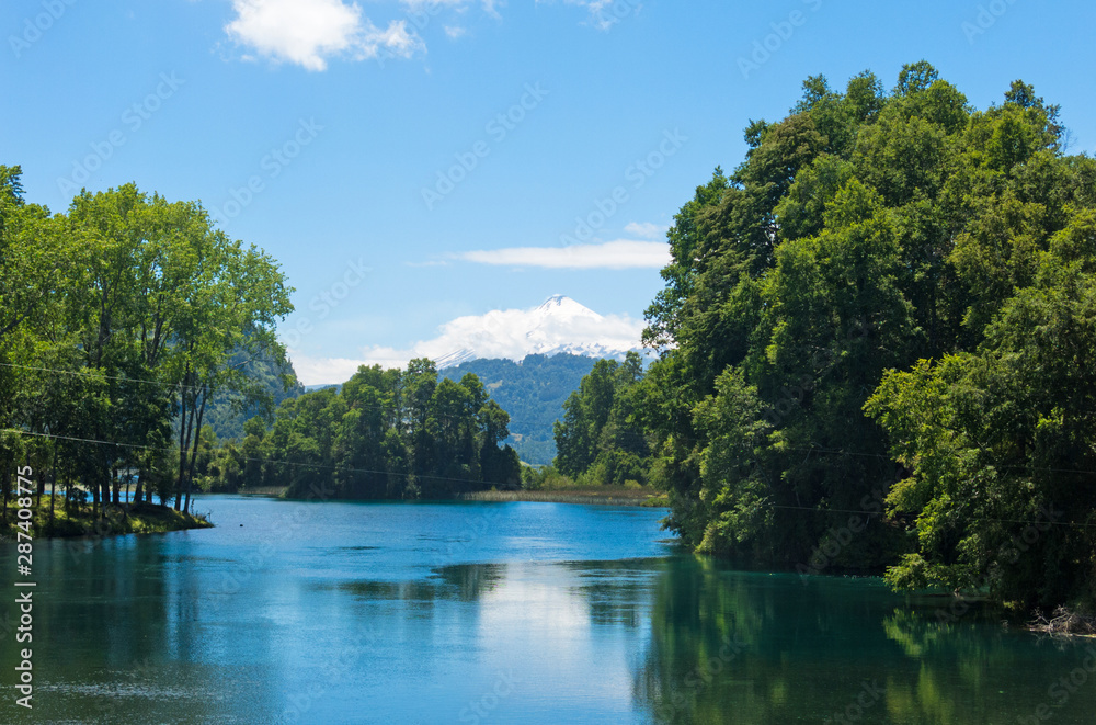 the snowy Villarrica Volcano from the Pullinque lagoon, in the Chilean Patagonia, Los Rios region. Chile