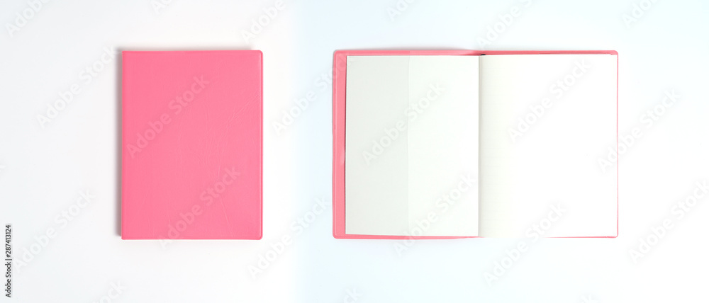 Pink notebook on white desk. Business minimal concept for women. Flat lay, top view, copy space Pink notebook on white desk. Business minimal concept for women. Flat lay, top view, copy space