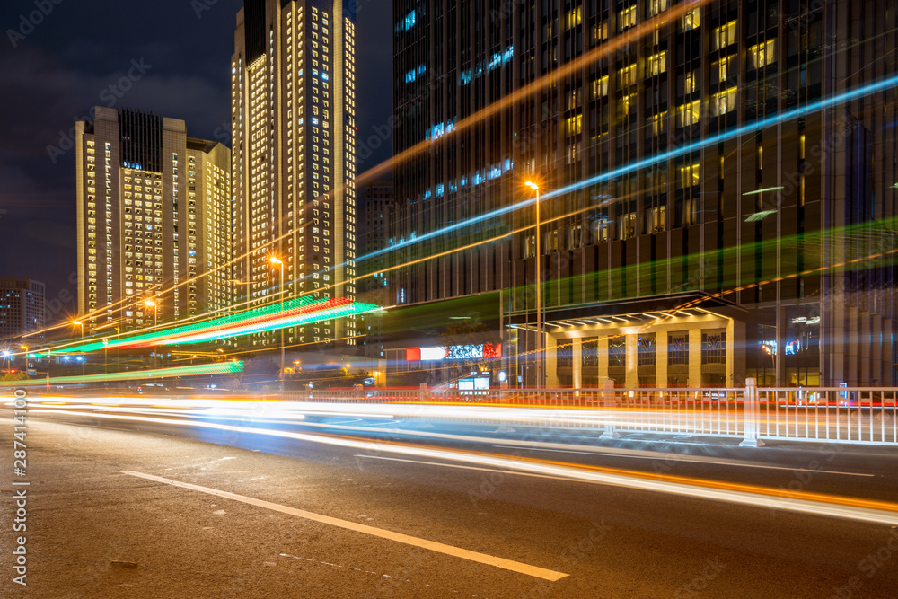 Obraz premium abstract image of blur motion of cars on the city road at night