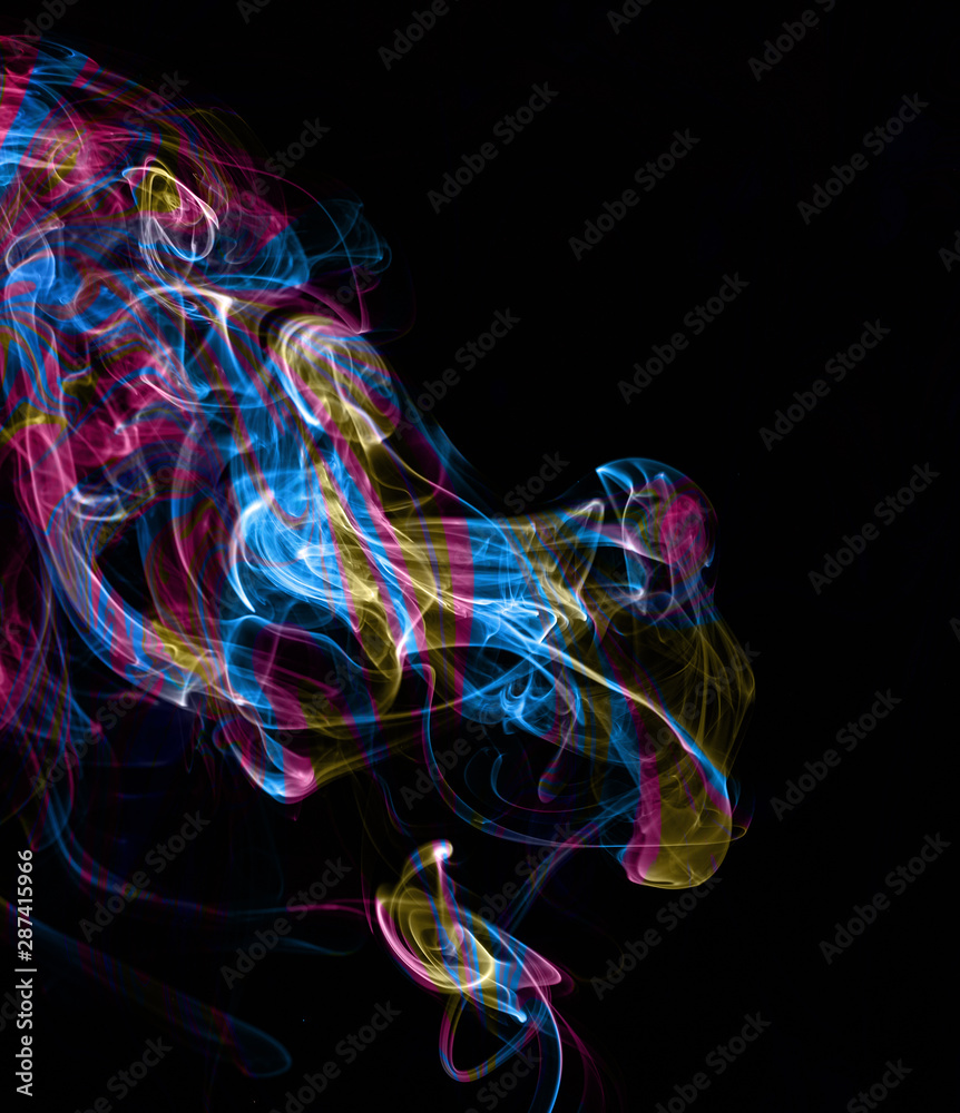 abstraction colored smoke on black background