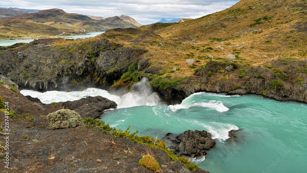 Obraz premium Waterfall in the mountains. Patagonia, Argentina