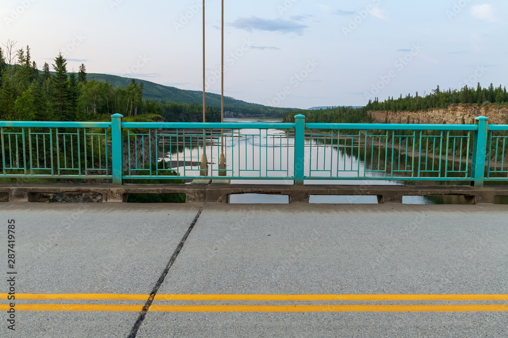 Overlooking Peace River from the suspension bridge in Hudson's Hope, British Columbia, Canada Overlooking Peace River from the suspension bridge in Hudson's Hope, British Columbia, Canada