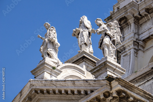 Statues on the facade at Basilica of Santa Maria della Salute in Venice, Italy