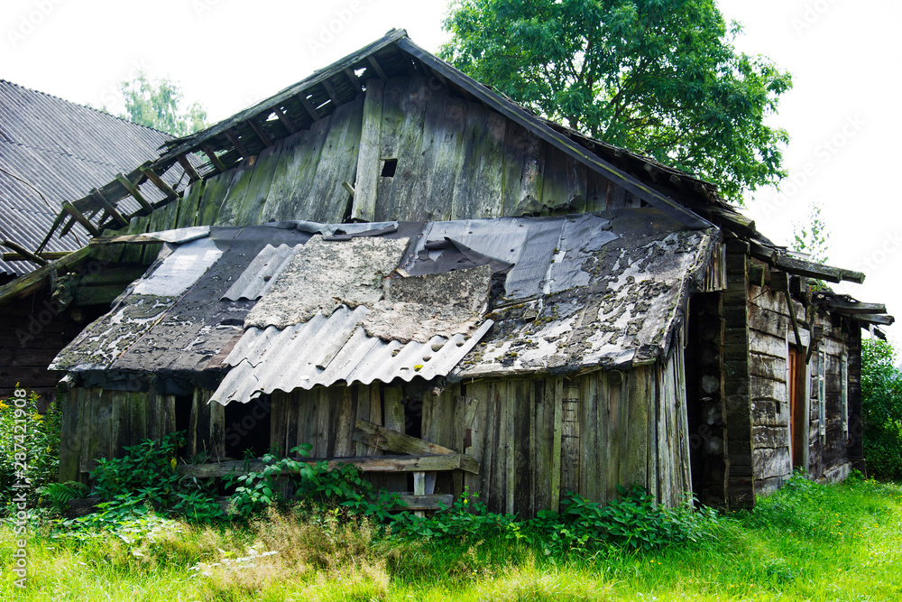 an old abandoned house with a ruined roof