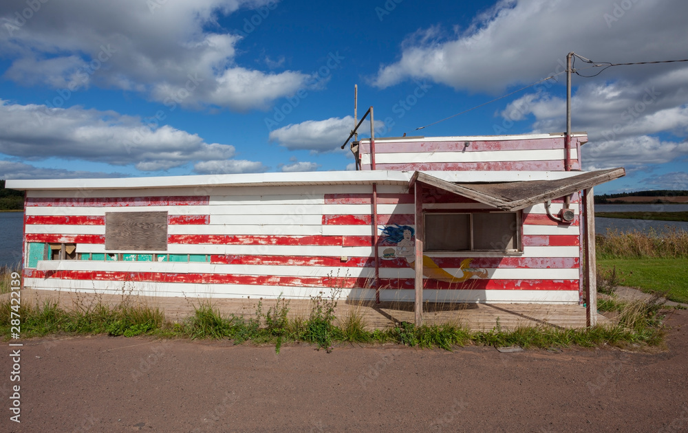 Abandoned, deserted red and white seafood shack. Abandoned, deserted red and white seafood shack.