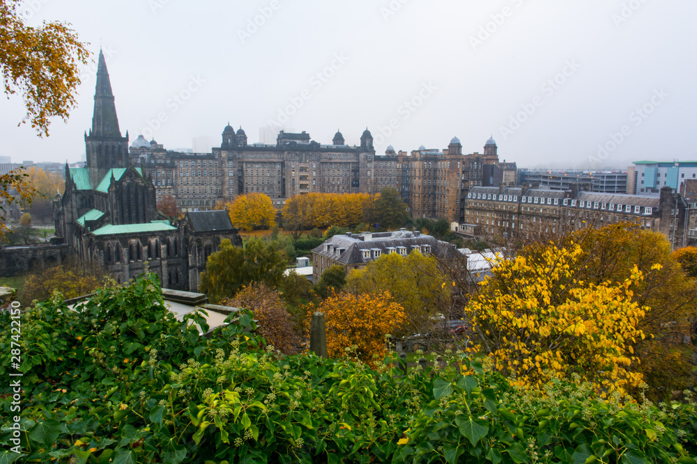 View of cloudy autumnal day in Glasgow. Photograph shows city view including Glasgow Cathedral and Glasgow Royal Infirmary. Taken in November.