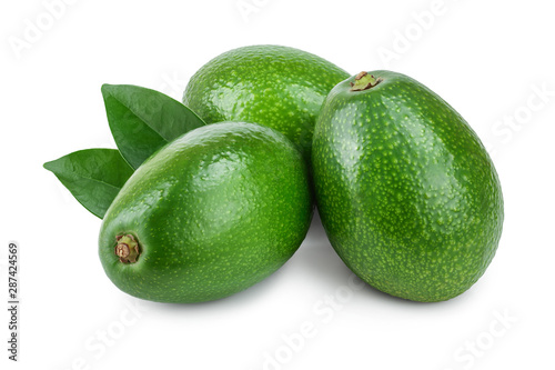 whole avocado with leaves isolated on white background close-up