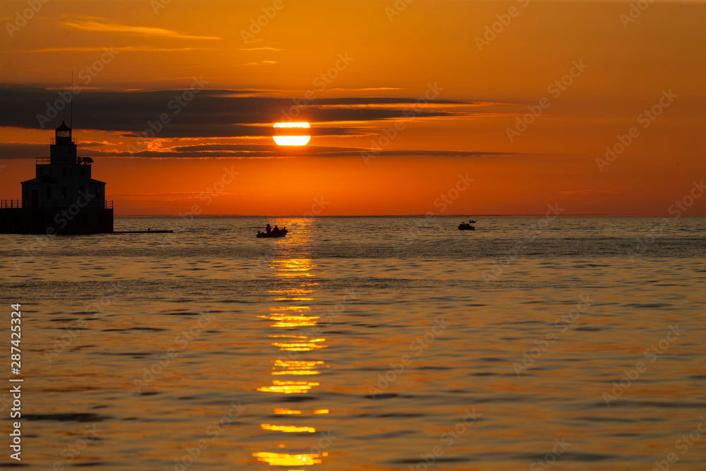 Sunrise at Lake Michigan Fishing boats sailing on Lake Michigan,  beginning the salmon fishing 