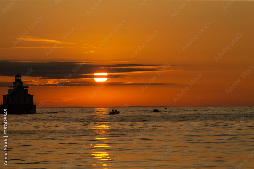 Sunrise at Lake Michigan Fishing boats sailing on Lake Michigan,  beginning the salmon fishing 