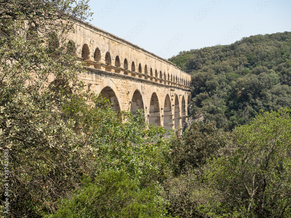 Obraz premium France, July 2019: Pont du Gard is an old Roman aqueduct near Nimes in Southern France